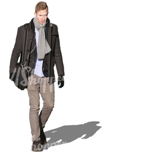 young man walking and listening to music