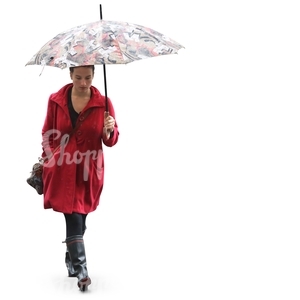 woman in a red coat and wellies walking under an umbrella