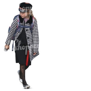 schoolgirl in a black and white coat walking and carrying a schoolbag