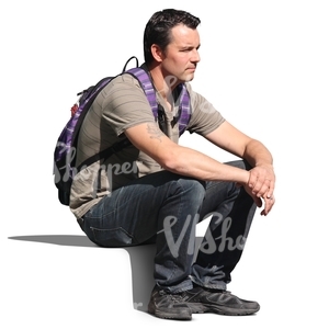 man with a backpack sitting