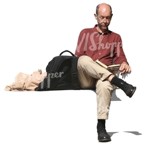 man sitting and reading a book