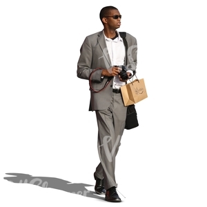 black man in a grey suit walking