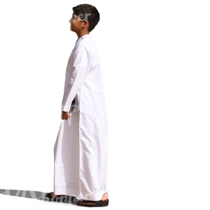 young arab boy in a thobe standing