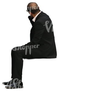 businessman man in a black suit sitting