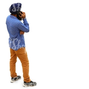 hindu man standing and talking on the phone