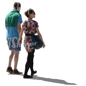 cut out backlit couple walking hand in hand