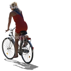 cut out backlit woman riding a bike