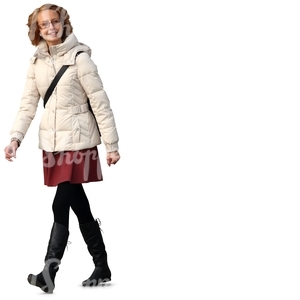 smiling woman in a white puffy coat walking