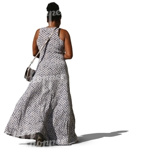 black woman in a long dress walking