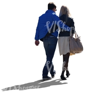 backlit couple walking arms around each other