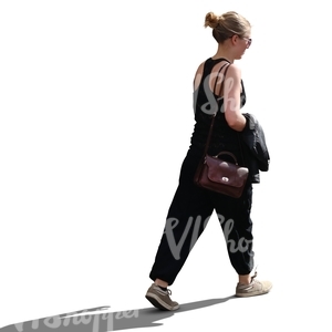 backlit woman walking in summertime