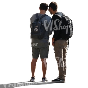 two backlit men standing and looking at smth