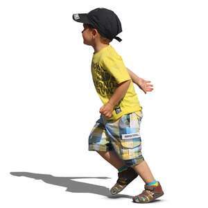 young boy in a yellow t-shirt running
