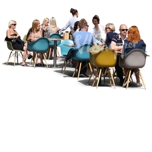 group of people sittnin in a street cafe in summertime