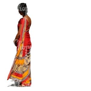 Indian woman wearing a colorful red sari standing