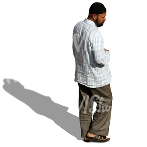 man with a black cap walking