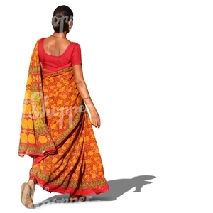 indian woman in a traditional orange sari walking