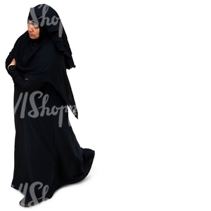 muslim woman in a black abaya walking