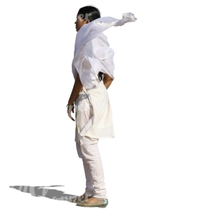 indian woman in a white salwa kameez standing in the wind