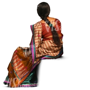 indian woman wearing a sari sitting