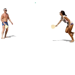 man and woman playing racquetball on the beach