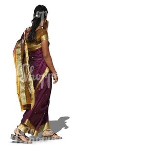 hindu woman wearing a sari walking