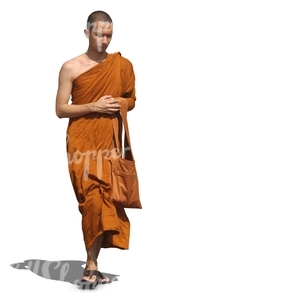 young buddhist monk walking