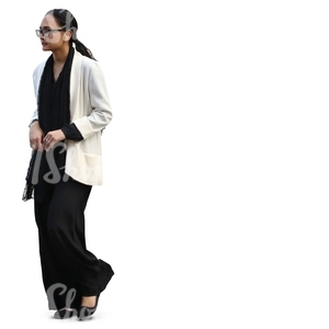 woman in a black and white outfit walking