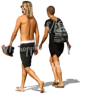 man and woman walking on the beach