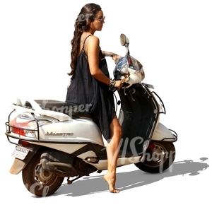 woman in a black dress on a scooter