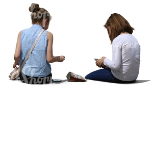 two teenage girls sitting