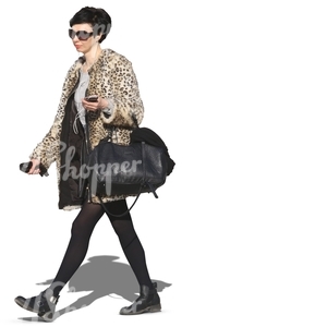 woman with sunglasses and earphones walking in autumn