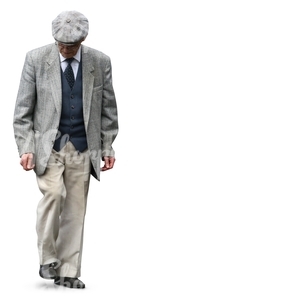 elderly man in an elegant grey suit walking