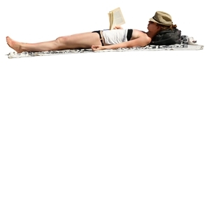 woman sunbathing and reading a book