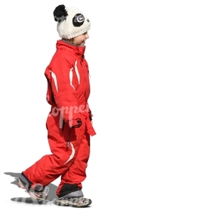 little girl in a red onsie walking and smiling