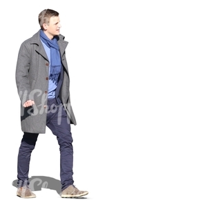 man wearing a grey coat walking in sunlight