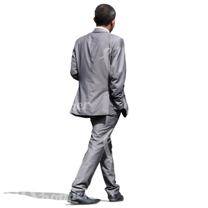 businessman in a grey suit walking