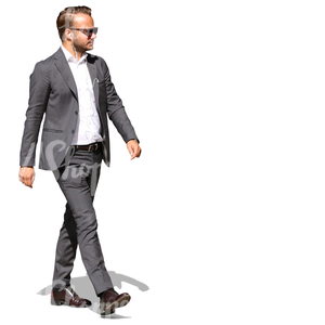 businessman with headphones walking