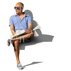 man sitting and reading a newspaper