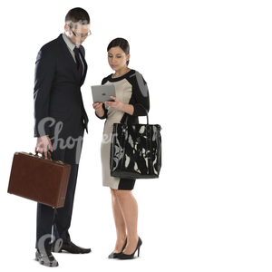 businessman and businesswoman standing and looking at ipad