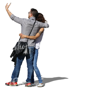 asian couple taking a selfie while hugging each other