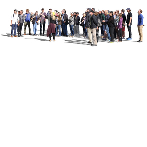 big group of people standing and listening to their guide