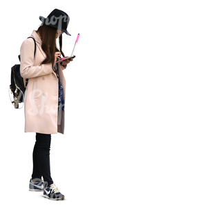 asian woman standind and looking at her tablet