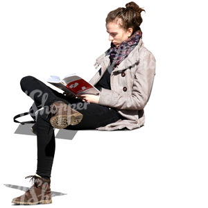 young woman sitting on a bench and reading