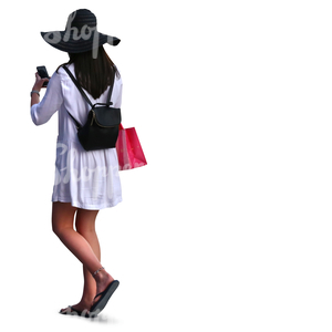 woman with a large hat and white dress doing some shopping