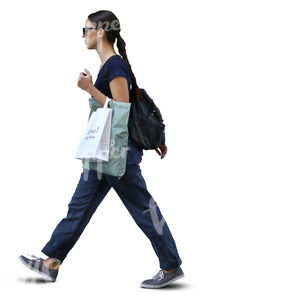 stylish woman with shopping bags walking in ambient light