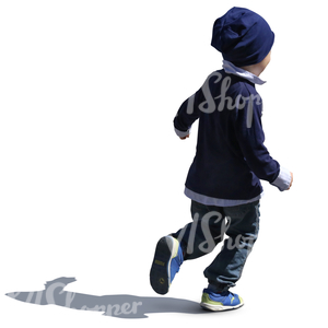 backlit small boy with a blue hat running
