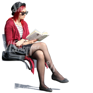 woman with sunglasses sitting outside and reading