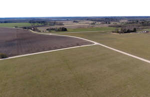 countryside with fields and houses seen from above