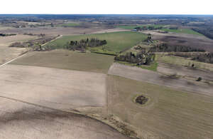 countryside with bare fields in early spring shot from high above